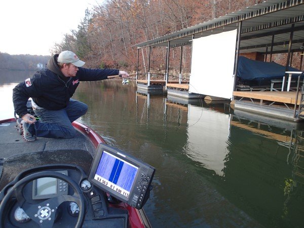 Travis Bunting loads the rod to shoot a floating dock. It takes timing and practice to shoot but no other technique allows the jig to be put in small openings at long distances.