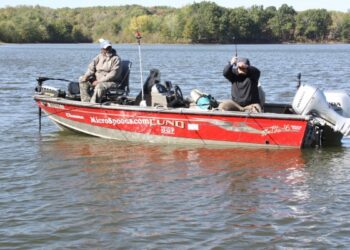 Russ Bailey, host of Brushpile Fishing, gets schooled about Hang Gliding by Ken Smith on Sheango Lake. It works!