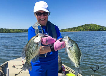 Jeanne Huffman shows off a beautiful brace of crappie, including a black and crappie taken while pulling crankbaits in Arkansas. (Photo: Tim Huffman)