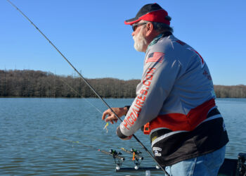 Greg Robinson reads the water and his electronics to figure out tactics.