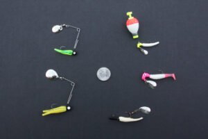 Flash & Thump jigs (clockwise from the top) include 1/32-ounce Road Runner Head fished under a float; 1/16-ounce Road Runner Head with shad tail body; Charlie Brewer’s Whirly Bee; 1/8-ounce Beetle Spin; 1/16-ounce Beetle Spin.