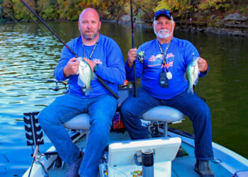 Steve Jeffers (right) fishing with Allen Reed in Kentucky. The fall colors indicate one of the prime times to pinpoint crappie in shallow water. Fish can be caught year-round, but fall and spring are the best times for the approach.