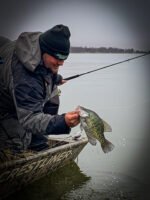 Will Hutto pulling a crappie from Lake Washington