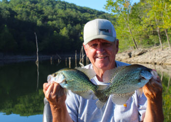 Check out the background behind Larry Cloud and it is easy to see why Missouri’s Table Rock Lake holds great numbers of crappie. When the U.S. Army Corps of Engineers created the lake in 1958, it left all of the standing timber untouched. (Photo: Richard Simms)