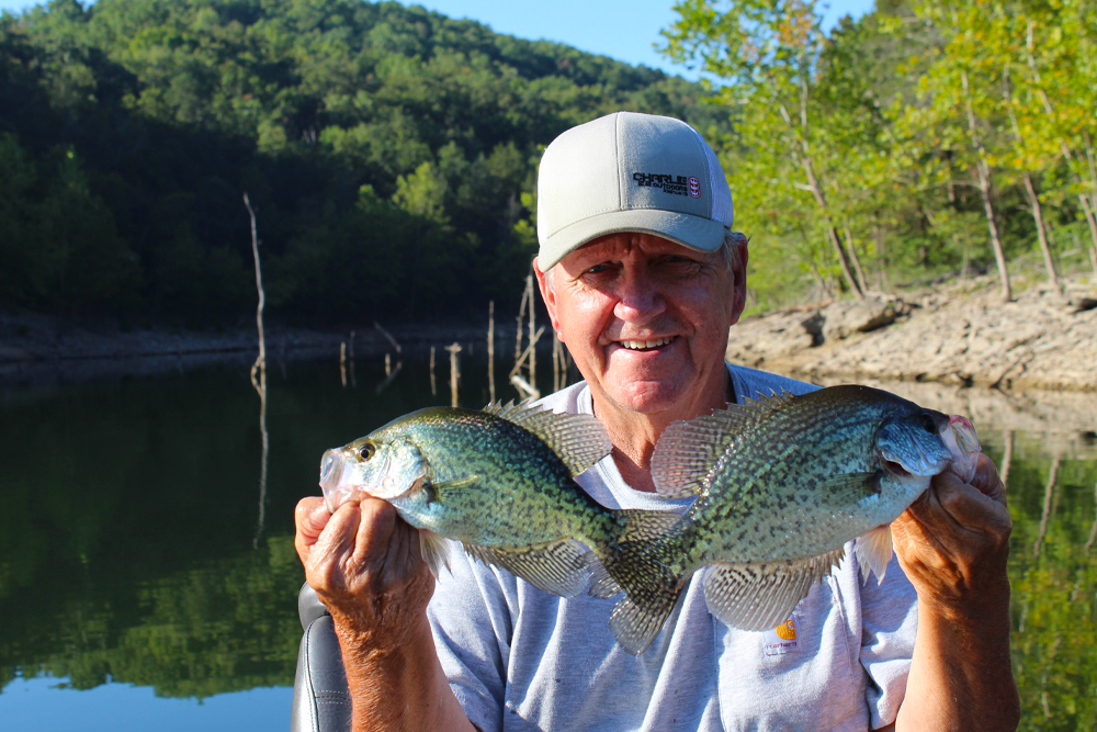 Check out the background behind Larry Cloud and it is easy to see why Missouri’s Table Rock Lake holds great numbers of crappie. When the U.S. Army Corps of Engineers created the lake in 1958, it left all of the standing timber untouched. (Photo: Richard Simms)